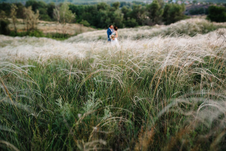 A couple in love a guy and a girl on a walk in the forest beltの写真素材