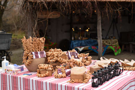 dry bagels and bagels on a table with a painted Ukrainian tableclothの写真素材