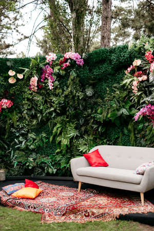 decorative bright green photo zone in marakan style with natural flowersの写真素材