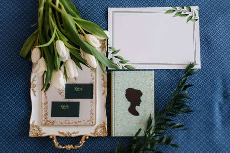 elegant wedding bouquet of fresh natural flowers and greenery with bookの写真素材