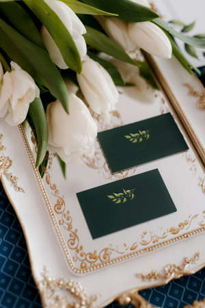 elegant wedding bouquet of fresh natural flowers and greenery with bookの写真素材
