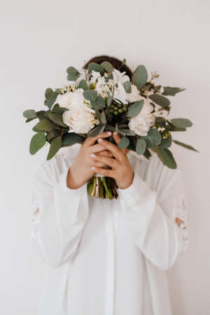 elegant wedding bouquet of fresh natural flowers and greeneryの写真素材