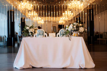 The presidium of the newlyweds in the banquet hall of the restaurant is decoratedの写真素材