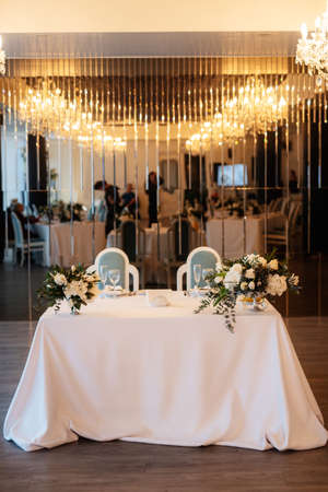 The presidium of the newlyweds in the banquet hall of the restaurant is decoratedの写真素材