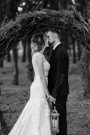 walk of the bride and groom through the autumn forest in Octoberの写真素材