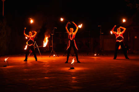 Night fiery pieces of a fire showの写真素材