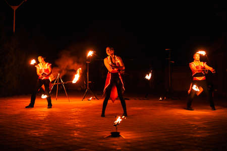 Night fiery pieces of a fire showの写真素材