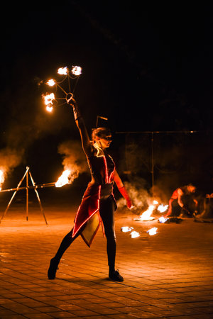 Night fiery pieces of a fire showの写真素材