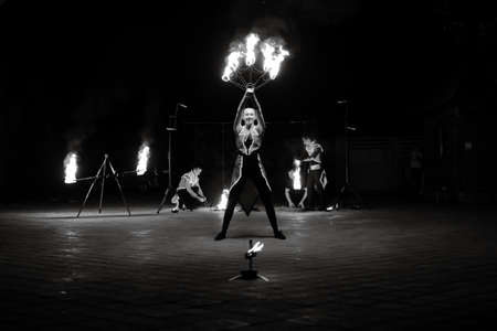 Night fiery pieces of a fire showの写真素材