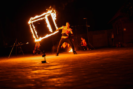 Night fiery pieces of a fire showの写真素材