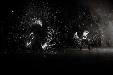 Night fiery pieces of a fire showの写真素材