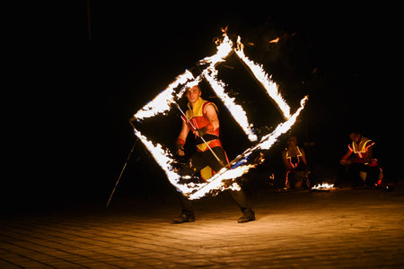 Night fiery pieces of a fire showの写真素材