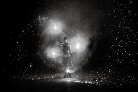 Night fiery pieces of a fire showの写真素材