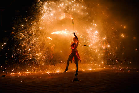 Night fiery pieces of a fire showの写真素材