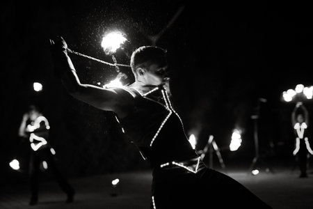 Night fiery pieces of a fire showの写真素材