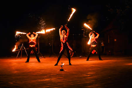 Night fiery pieces of a fire showの写真素材