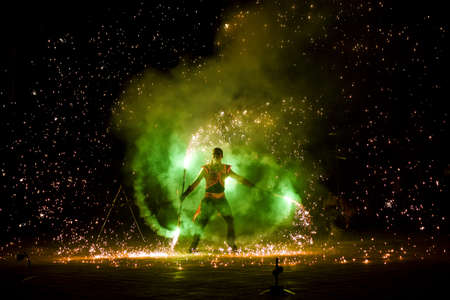 Night fiery pieces of a fire showの写真素材