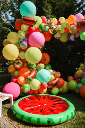 photo zone with bright inflatable elements in the form of different fruitsの写真素材