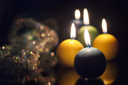 christmas candles close up on dark backgroundの写真素材