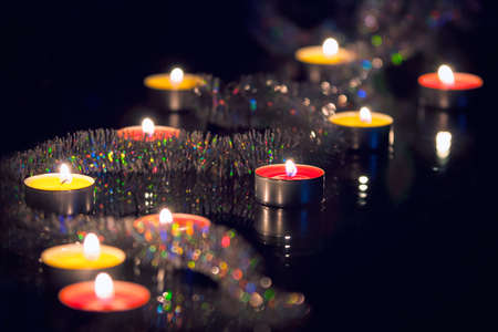 christmas candles close up on dark backgroundの写真素材