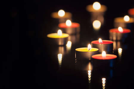 christmas candles close up on dark backgroundの写真素材
