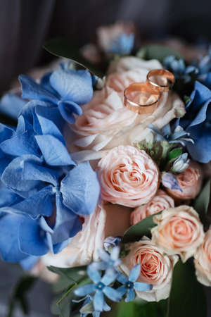 gold wedding rings as an attribute of a young couple's weddingの写真素材
