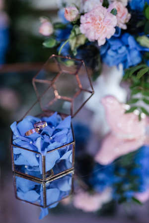 gold wedding rings as an attribute of a young couple's weddingの写真素材