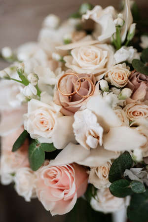 gold wedding rings as an attribute of a young couple's weddingの写真素材