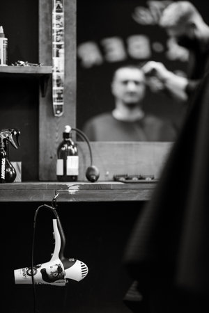 the tools of a Barber on the desktop in front of the mirrorの写真素材
