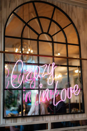 neon lettering in pink on a transparent borderの写真素材