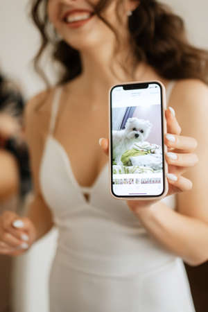 white terrier next to a manの写真素材
