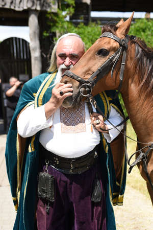 Zaporozhye Cossacks from the Zaporozhye army in national costumes on horsebackのeditorial素材
