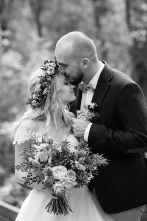 walk of the bride and groom through the autumn forest in Octoberの写真素材