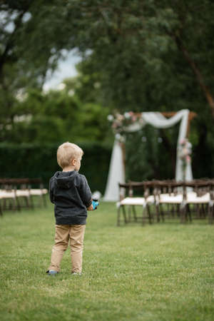 wedding ceremony area with dried flowers in a meadow in a pine brown forestの写真素材