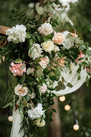 wedding ceremony area with dried flowers in a meadow in a pine brown forestの写真素材