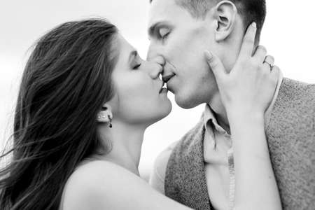 young couple a guy and a girl are walking in the green mountain hillsの写真素材