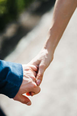 guy and a girl happily walk in the morning on the empty streets of old Europeの写真素材