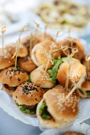 welcome buffet with alcohol and snacks, sandwiches, cupcakesの写真素材