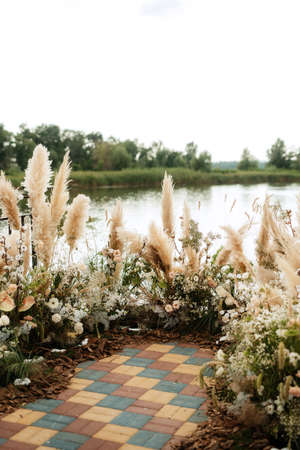 Hona wedding ceremony on the pier near the waterの写真素材