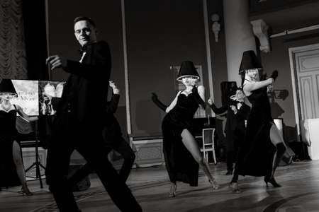 performance of a show-ballet of a dance group of actors in bright costumesのeditorial素材