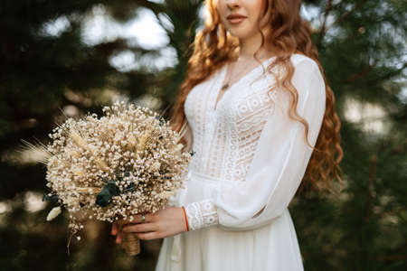 elegant wedding bouquet of fresh natural flowers and greeneryの写真素材