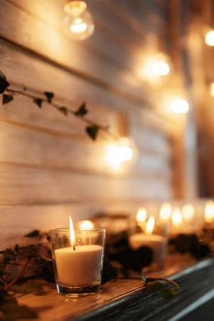 atmospheric candle decor with live fire on the banquet tableの写真素材
