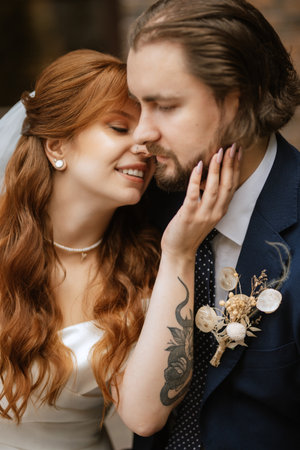 young couple bride and groom in a white dressの写真素材