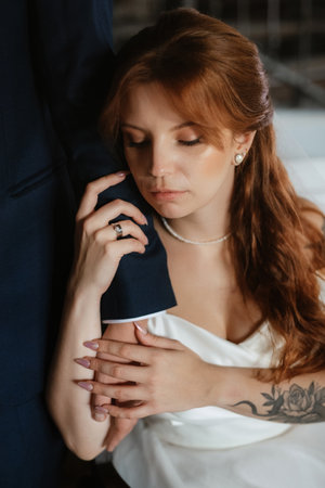 young couple bride and groom in a white dress walkingの写真素材