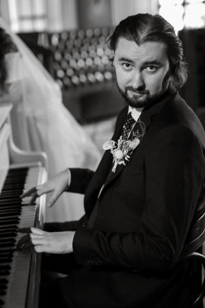 young couple bride and groom in a white dress walkingの写真素材