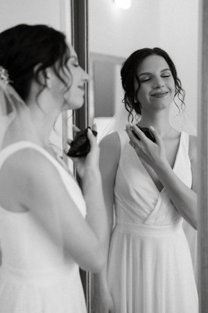 preparations for the bride with the dressing of the wedding dress in the studioの写真素材