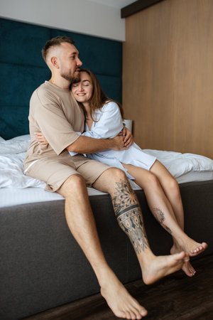 early morning bride and groom at home in bed