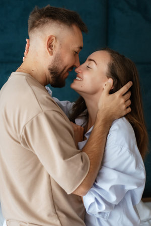 early morning bride and groom at home in bed