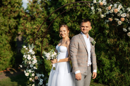 wedding ceremony of the newlyweds on the glade near the restaurantの写真素材