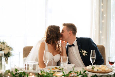 portrait of the newlyweds at the presidium at the wedding banquetの写真素材